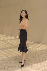Silk flared midi skirt with front slit and pom-pom trim hem for elegant movement